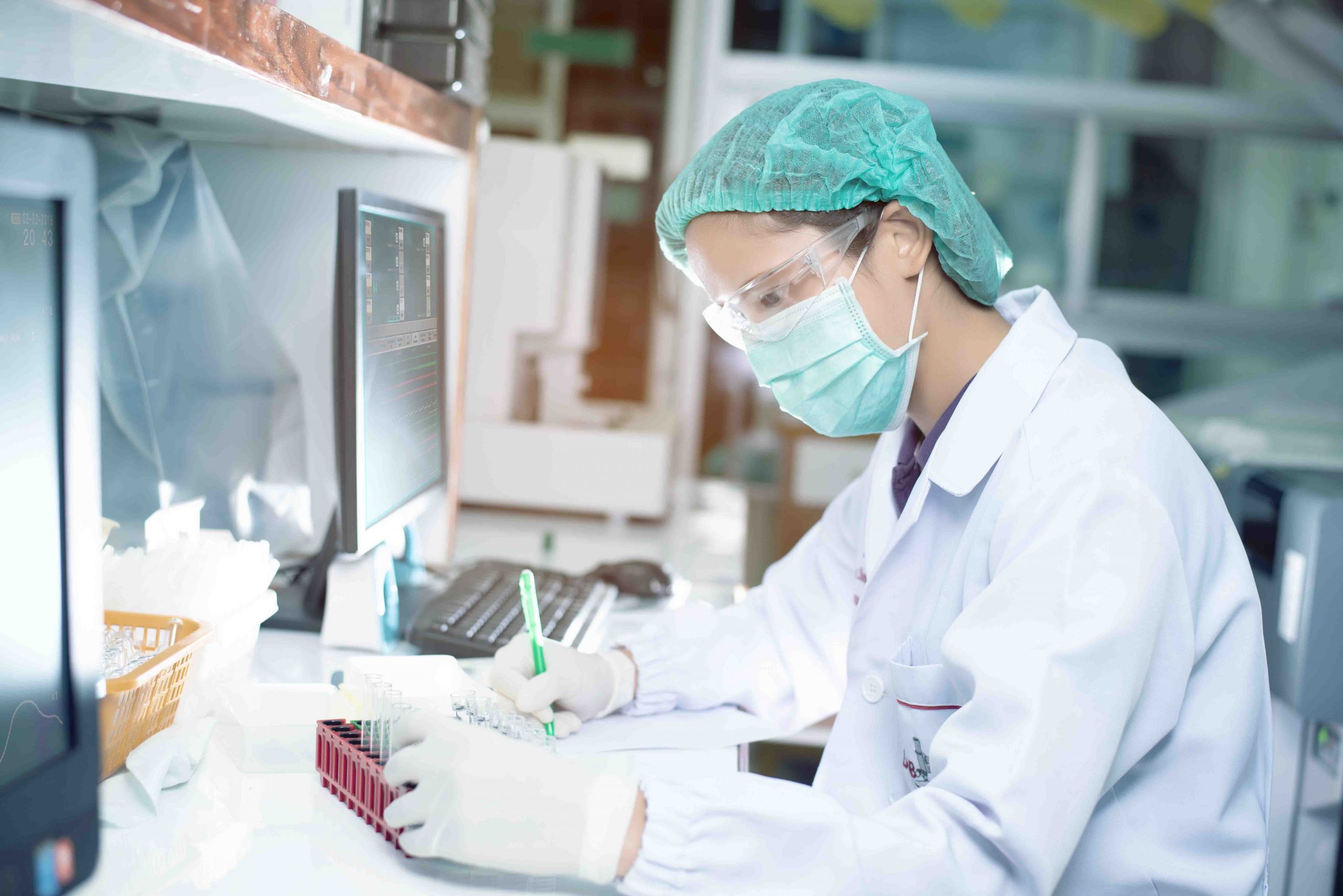 Portrait of a female researcher working in a lab scientist using
